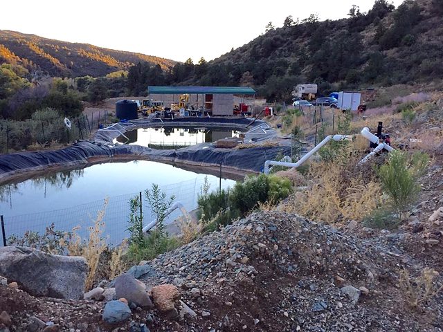 Settling ponds and site camp at dusk